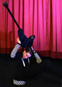 Luke performs stilt contortion