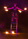 free standing ladder balance while fire spinning, australia