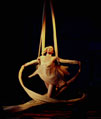 Aerialist Eve Everard performs Trapeze routine for clockwork butterfly
