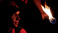 fire juggler and fire eater performing a fire circus show in Australia